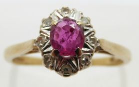 An 18ct gold ring set with an oval cut ruby of approximately 0.