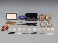 A quantity of mother of pearl blank counters, a fruit knife in the form of a shoe, photo frames,