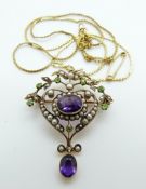 An early 20thC 9ct gold pendant set with two oval cut amethysts,