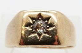 A 9ct gold ring set with an old cut diamond of approximately 0.15ct in a star setting, size R, 5.