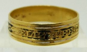 A Georgian yellow metal ring set with enamel reading 