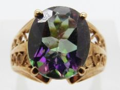 A 9ct gold ring set with a treated topaz with pierced shoulders, size J/K, 4.