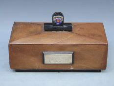 A mahogany presentation box with hallmarked silver plaque to front,