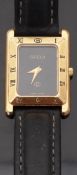 Gucci 4200 FL wristwatch with gold hands, black face, Roman numerals to the bezel,