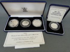 A 1994 UK three coin silver proof coin collection,