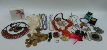 A collection of costume jewellery including necklaces, brooches, filigree brooch, silver earrings,
