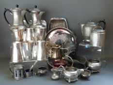 A collection of pewter and silver plated ware including Arts and Crafts style hammered items