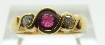 An 18ct gold ring set with a ruby of approximately 0.3ct and two diamonds, size N/O, 4.