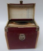 A large quantity of singles and a vintage record case