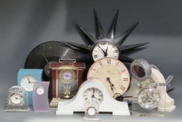 A collection of variously styled quartz clocks to include glass cased, anniversary,
