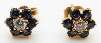 A pair of 18ct gold earrings each set with a diamond of approximately 0.