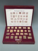 Twenty-five 'Empire Collection' hallmarked silver gilt replica stamps, 467g,