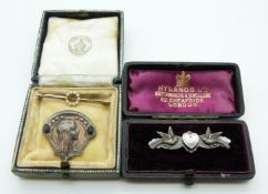 An Art Nouveau brooch by Geschuzt in the form of a young lady,