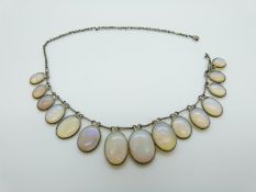 A Victorian necklace set with graduated oval opals