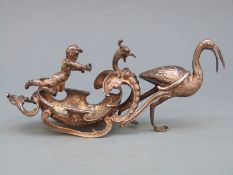 Victorian hallmarked silver novelty figural salt decorated with putti, griffin and stork or crane,