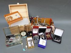 A collection of costume jewellery necklaces, faux pearls, earrings,