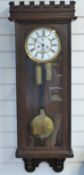 Oak cased Vienna regulator two-train wall clock, c1900, with castellated top,