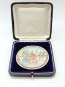 A miniature portrait brooch hand painted with an Indian dancing scene,