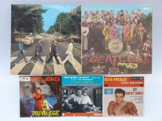 A mixed box of approximately 70 LP's and 50 singles.