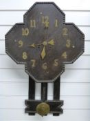 Arts and Crafts style oak wall clock with beaded decoration,