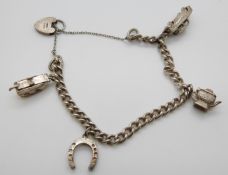 A silver charm bracelet with an Air France taxi charm,