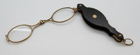 A pair of yellow metal and tortoiseshell lorgnettes