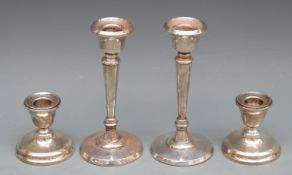 Two pairs of hallmarked silver candlesticks, tallest pair 13.