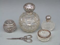 George V hallmarked silver mounted globe shaped cut glass dressing table bottle, Birmingham 1906,