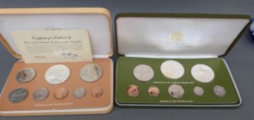 A cased Trinidad and Tobago coin set together with a Cook Islands proof coin set