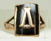 A 9ct gold Victorian ring set with black onyx and a gold letter to the centre, size N, 2.