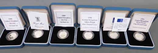 Six cased Royal Mint silver proof one pound coins with certificates