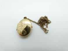 A 9ct gold chain and locket, 3.