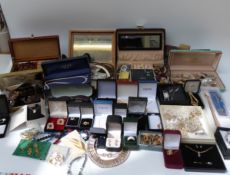 A large collection of costume jewellery including beads, brooches, earrings,