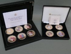 Two cases of Queen Elizabeth II commemorative gold plated picture coins,