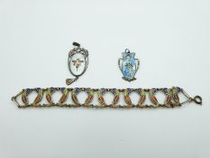 A hallmarked silver Charles Horner pendant set with enamel,