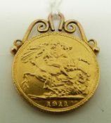 A 1911 gold full sovereign in yellow metal mount, 8.
