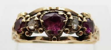 A Victorian ring set with two rose cut diamonds and three rubies in foiled settings,