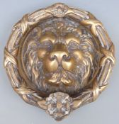 A large brass lion mask door knocker, maximum diameter 25.5cm, 3.