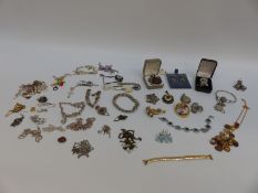 A collection of silver jewellery to include pendants, chains, agate brooch, Chinese jadeite pendant,