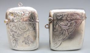 Two early 20th century hallmarked silver vestas, both with engraved decoration,
