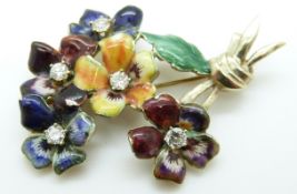 A 14k gold brooch in the form of a posy of pansies set with enamel and diamonds to the centre
