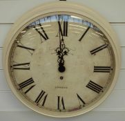 A Newgate quartz dial wall clock with Roman numerals, mushroom coloured finish,