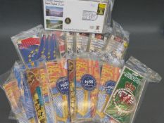 A collection of brilliant uncirculated etc 50 pence and £1 coins in collectors' packs includes two