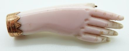 A Victorian brooch in the form of a hand