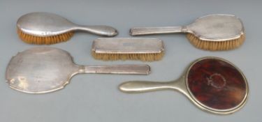 Three piece hallmarked silver mounted dressing table set including hand mirror,