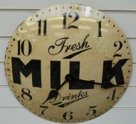 A caseless quartz dial wall clock with 'Fresh Milk Drinks at the Bar' advertising slogan to the