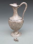Kutch Indian white metal ewer with embossed decoration inlcluding boar, deer, bear and lion hunting,