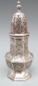 An Edward VII hallmarked silver sugar caster of octagonal form with embossed decoration,