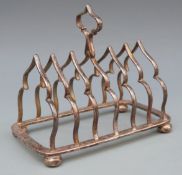 Victorian or Edward VII hallmarked silver Gothic style six division toast rack,