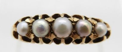 An 18ct gold ring set with five pearls, size M, 3.